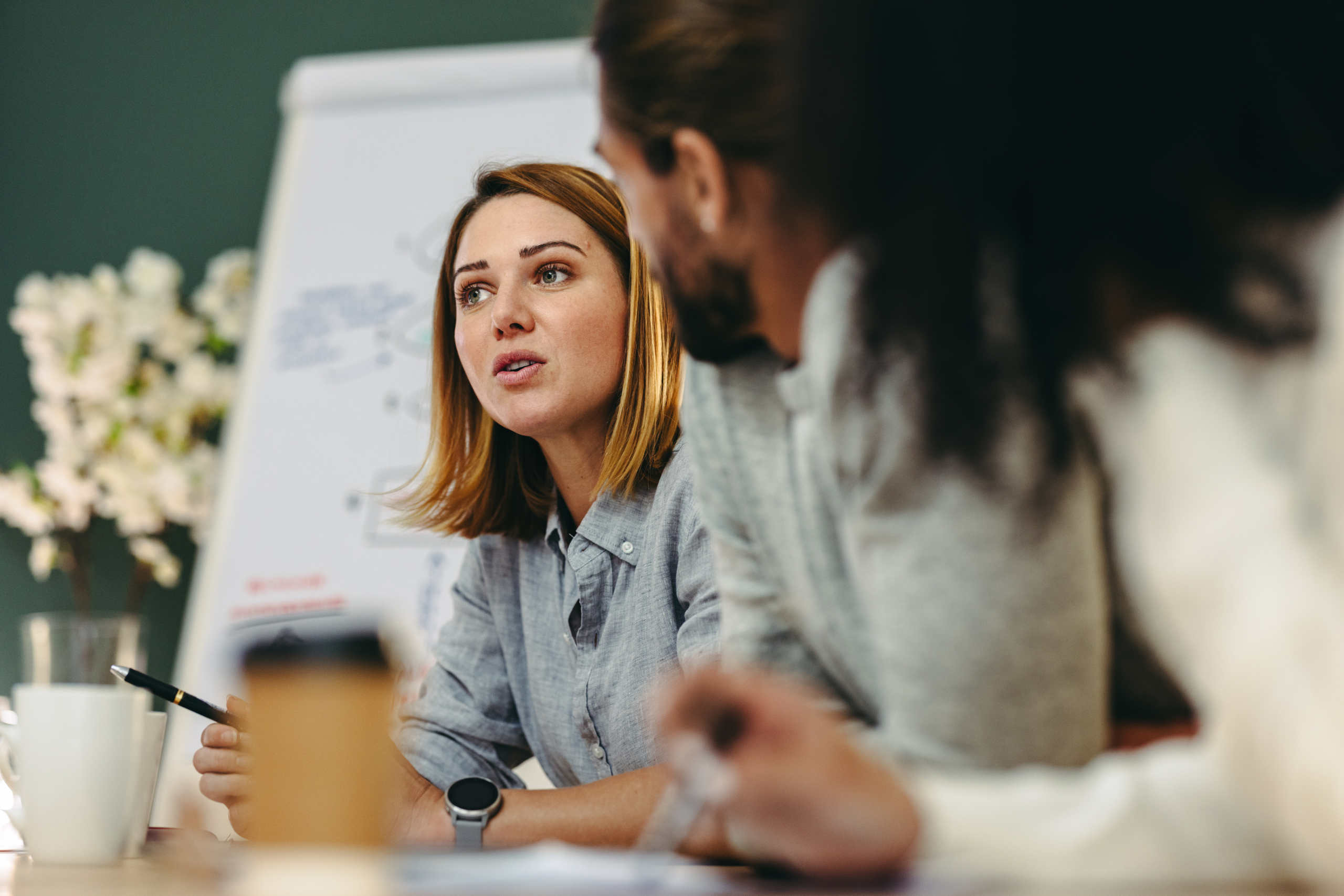 Young women leading business meeting